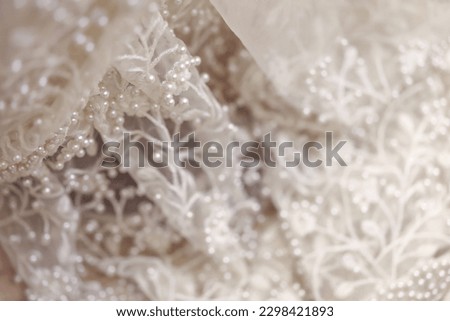 Close up of detail on wedding gown Royalty-Free Stock Photo #2298421893