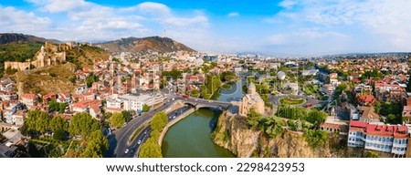 Tbilisi old town aerial panoramic view. Tbilisi is the capital and the largest city of Georgia, lying on the banks of the Kura River. Royalty-Free Stock Photo #2298423953