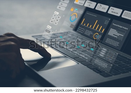 Analyst computer working with information database to analysis marketing sale data. Business project or program strategy planning and development for corporate operating finance and investment concept Royalty-Free Stock Photo #2298432725