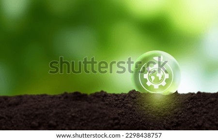 Natural climate solutions concept. Action for avoid greenhouse gas emissions and increase carbon storage in forests, grassland and wetlands. Gears and globe with leafs on nature background. Royalty-Free Stock Photo #2298438757
