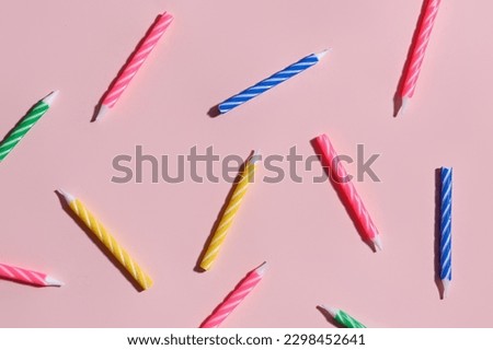 Birthday candles on pink background