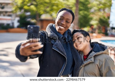 African american mother and son smiling confident make selfie by the smartphone at park