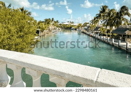 Scenic view of beautiful water way on Duck Key, Florida, USA against blue sky with clouds