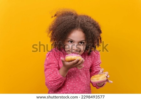 This donut makes her mouth water. So yummy.