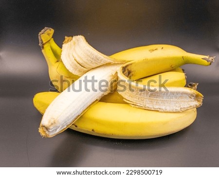 An image of bananas on a black background can be an interesting choice, as the contrast between the yellow fruit and the dark background can create an attractive and impressive visual image.