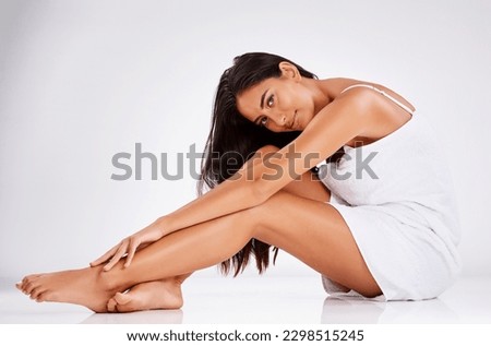 Legs every woman wants. Studio portrait of a beautiful young woman posing against a gray background.
