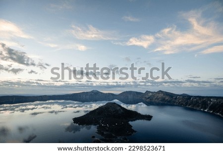 Wizard Island Juts Out Into Crater Lake From The Watchman Overlook in Crater Lake National Park Royalty-Free Stock Photo #2298523671