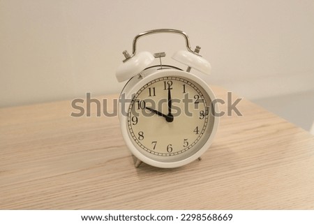 Close-up photo of clock on office desk.