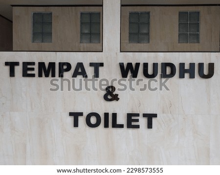 Ablution Place and Toilet Signs. Toilet icon with Indonesian letters.
