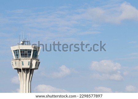 Air control tower at the airport with blue sky and clouds on the background. Istanbul Ataturk airport air control tower. landing and take-off clearance. No people, nobody. Horizontal photo. 
