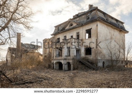 large abandoned house, ruined area Royalty-Free Stock Photo #2298595277