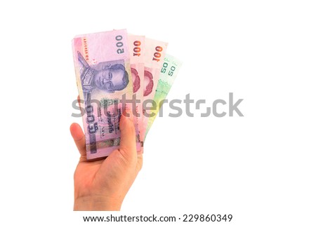 right hand holding thailand paper currency from below isolated on white
