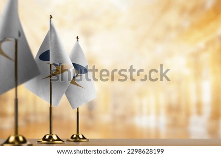 Small flags of the Eurasian Economic Union on an abstract blurry background. Royalty-Free Stock Photo #2298628199