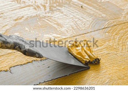 Wooden Surface Paint Removal Process. High quality photo Royalty-Free Stock Photo #2298636201