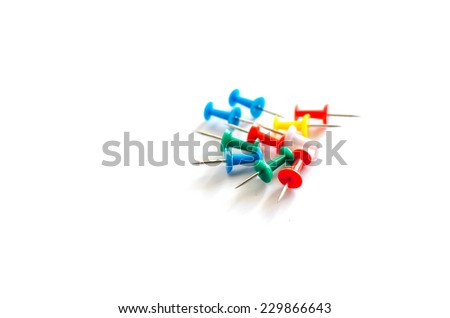 colorful pushpins on a white background
