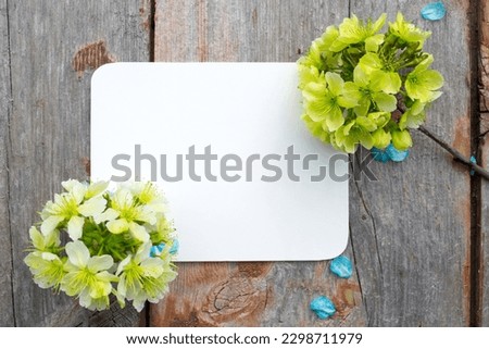 greeting, wishing card banner. Elegant quote for poster cherry blossoms of light green and blue colors on old wooden background. Free empty space for your text, wishing. Happy birthday. mothrer's day