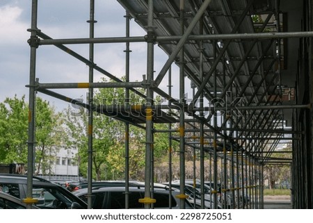 construction site, the scaffolding on a building is assembled by designing every detail for safety. Detail of the front galvanized steel structure. Royalty-Free Stock Photo #2298725051