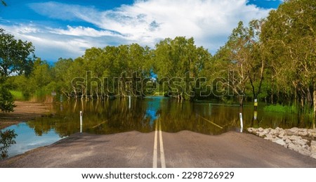 Flooded Magela Creek Crossing Road during the rainy season, Kakadu National Park, Northern Territory of Australia Royalty-Free Stock Photo #2298726929