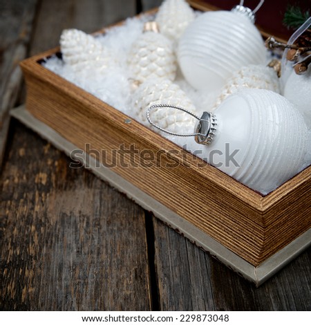 Christmas decorations in a wooden box with copy space for inscriptions