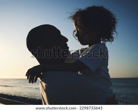 Silhouette, father and girl hug, beach and bonding with summer holiday, loving and quality time. Family, dad and daughter embrace, seaside vacation and getaway trip with happiness, break and loving