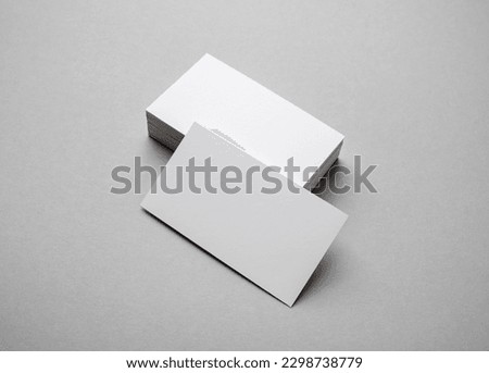 Blank business cards on gray paper background. Template for graphic designers portfolios.