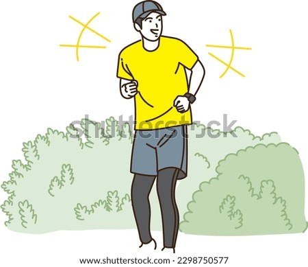 Young man jogging outdoors smiling
