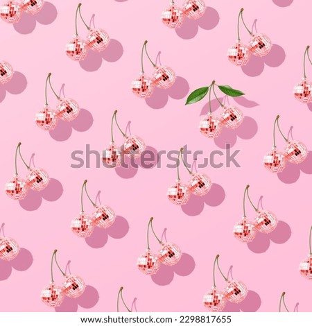 Trendy pattern composition made with Decorative disco balls like cherries on pastel pink background. Concept of minimal entertainment. Flat lai. Contemporary style. Creative art, minimal aesthetics. Royalty-Free Stock Photo #2298817655