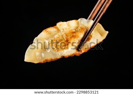 Fried dumplings filled with leeks Royalty-Free Stock Photo #2298853121