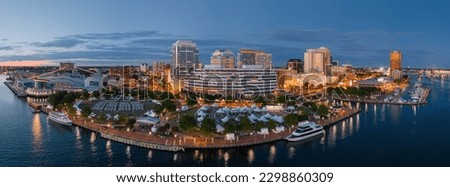 Norfolk, Virginia, USA downtown city skyline from over the Elizabeth River at dusk. Royalty-Free Stock Photo #2298860309