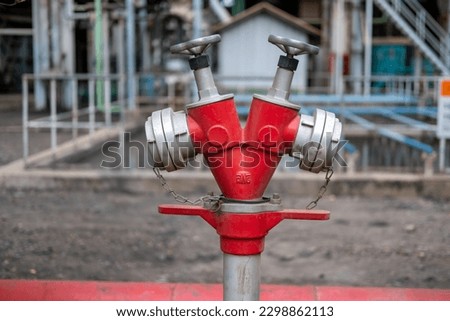 Industrial Water fire extinguishing system transfer. Fire safety. Manual gate valve on the fire hydrant. V type red fire hydrant