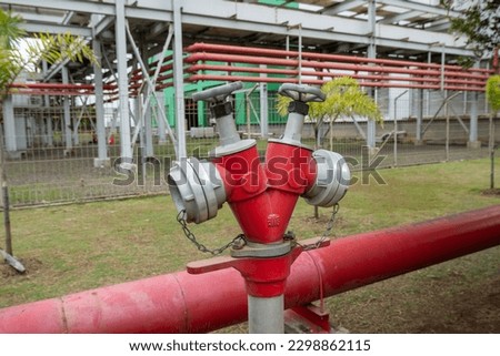 Industrial Water fire extinguishing system transfer. Fire safety. Manual gate valve on the fire hydrant. V type red fire hydrant