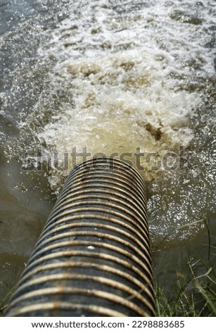 photo of sewage drain into the river