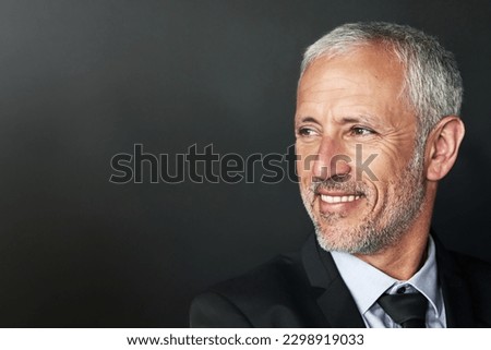 Businessman, thinking and happy with a smile on face with idea and space for mockup in studio. Headshot of a senior entrepreneur person on a black background for corporate vision and career pride