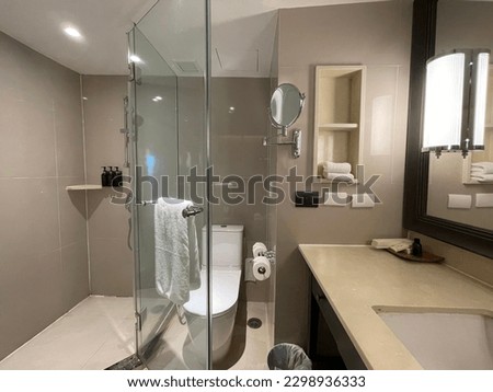 Bathroom decoration, tempered glass installation in bathroom Royalty-Free Stock Photo #2298936333