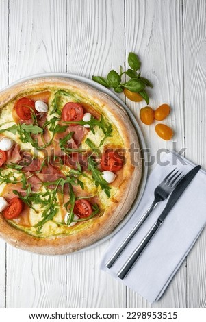 delicious pizza on a white wooden table. close-up	