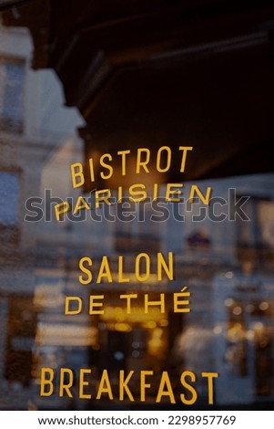 Sign on the window of a Parisian bistro