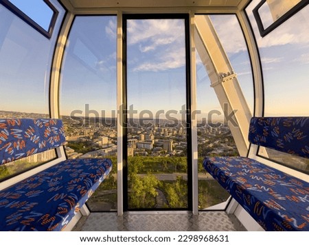 Interior of a cabin of ferris wheel in amusement luna park. Entertainment and fair concept. Inside of empty cabin Royalty-Free Stock Photo #2298968631
