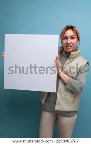 young blond hair woman demonstrating notice board with blank space