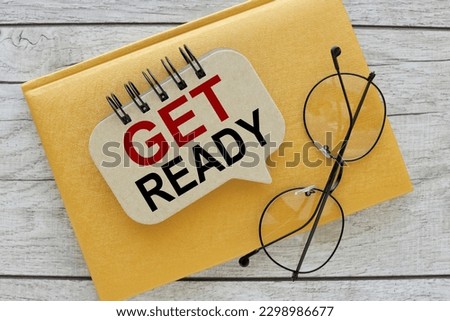 GET READY text on the cover of the notebook. two notepads on the desk. Business concept. Flat lay, top view