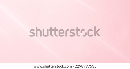 Pink paper texture background with sunbeams on it