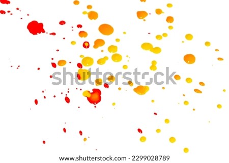 Spots of yellow and red paint on a white background. Splashes of paint colored on white. Drops of paint on a white canvas. Royalty-Free Stock Photo #2299028789