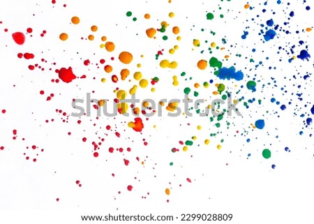 Splashes of paint on a white background. Colored spots of paint on a white background. There are many drops of colored paint on white paper. Royalty-Free Stock Photo #2299028809
