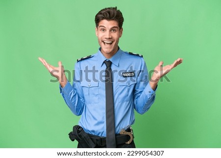 Young police man over isolated background with shocked facial expression