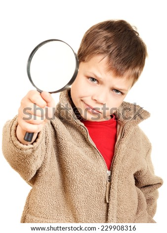 Little boy with magnifier on a white background