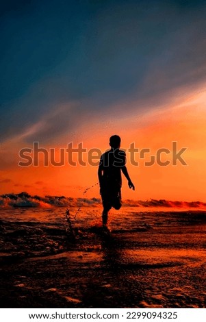 Silhouette photo of people running on the beach