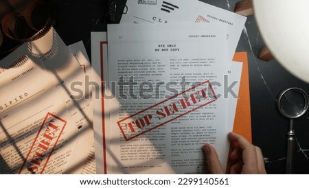 Intelligence discovers stolen and secret documents Royalty-Free Stock Photo #2299140561