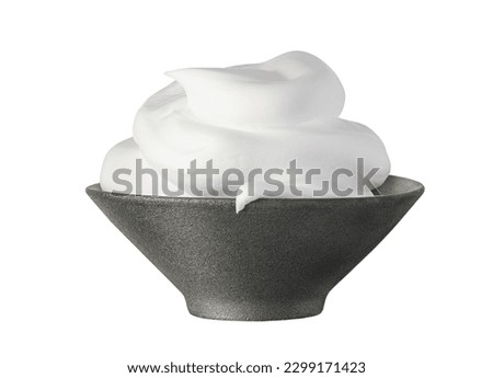 White shaving foam, cosmetic foam mousse, cleanser in black ceramic bowl isolated on white background. Skin care foamy product Royalty-Free Stock Photo #2299171423