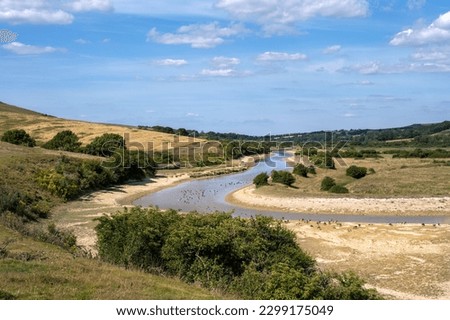 Low level water in Cuckmere river, East Sussex, England, in summer 2022 during a drought Royalty-Free Stock Photo #2299175049