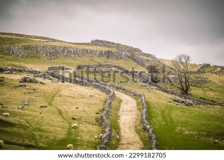 situated in Ribblesdale on the Settle–Carlisle Railway to the west of Pen-y-ghent. Royalty-Free Stock Photo #2299182705