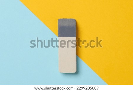 Eraser on a blue-yellow background